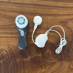 Gray and White Facial Cleansing Brush